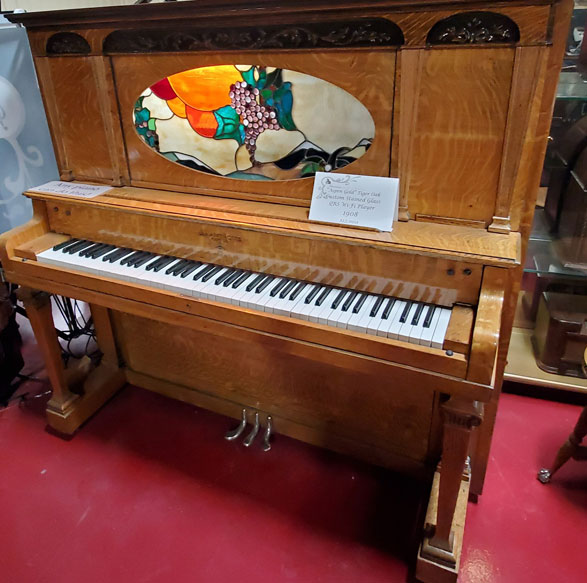 The Aspen 1908 tiger oak piano